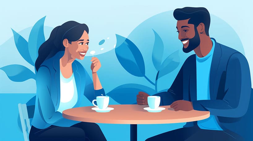 Twee mensen die tegenover elkaar zitten in een café glimlachend en in gesprek