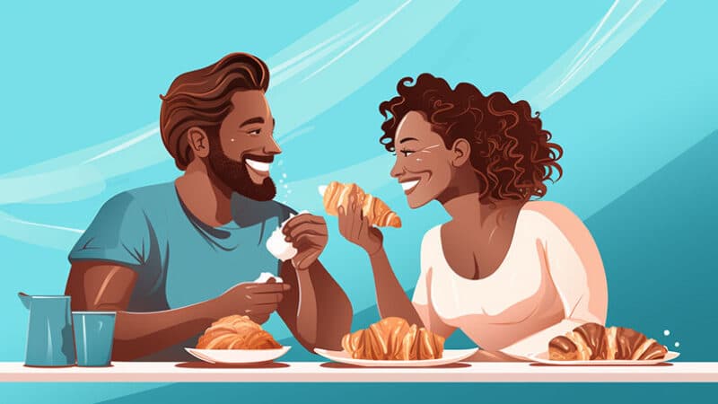 Romantisch ontbijt: croissant, stel lachen samen.